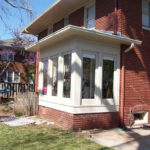 Exterior remodel, white frame windows