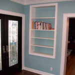 Double doors, inlaid window design, custom shelving