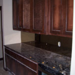 Kitchen renovation in progress, dark cabinets