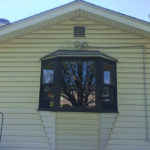 Bay window replacement - before and after exterior view